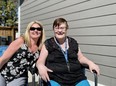 (L-R) Jannah Nicholson, manager of community inclusion for Elmwood Residences — "otherwise known as Delores' secretary," she jokes — celebrates with Delores Brock at the grand opening of three new group homes in Saskatoon.