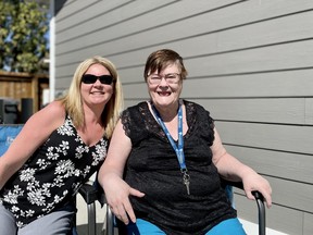 (L-R) Jannah Nicholson, manager of community inclusion for Elmwood Residences — "otherwise known as Delores' secretary," she jokes — celebrates with Delores Brock at the grand opening of three new group homes in Saskatoon.