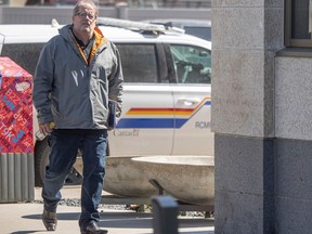 Michael Gordon Jackson, who is charged with abduction in contravention of a parenting order, walks into the King's Bench Courthouse on Thursday, April 11, 2024 in Regina. KAYLE NEIS / Regina Leader-Post