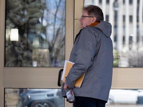 Michael Gordon Jackson who is charged with abduction in contravention of a parenting order, walks into the King's Bench Courthouse on Thursday, April 11, 2024 in Regina.