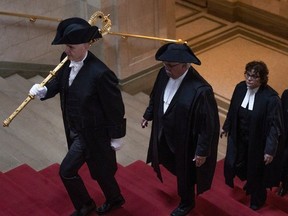 House Speaker Randy Weekes (second left) walks towards the chambers into the Legislative Assembly of Saskatchewan on Tuesday, April 16, 2024 in Regina.