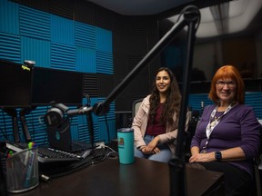 Kristy Auger, who is working on a blog for pîkiskwêwin while she lives with her grandmother in Alberta, learning cree sits beside Shannon Avison, the executive producer of pîkiskwêwin, an Indigenous language podcast network in the FNU podcast studio on Tuesday, April 2, 2024 in Regina.