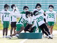 C.J. Avery (30) and Jaylen Moody (29) on the field during day one of Saskatchewan Roughriders Rookie training camp at Griffiths Stadium.