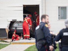 vehicle hits apartment building