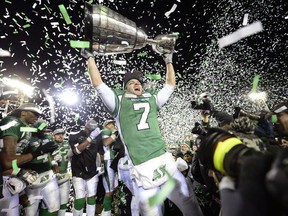 Saskatchewan Roughriders slotback Weston Dressler (#7) hoists the Grey Cup at the end of the 101st Grey Cup game held at Mosaic Stadium in Regina, Sask. on Sunday Nov. 24, 2013.