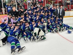 The Melfort Mustangs celebrate after winning the 2023-24 SJHL championship.