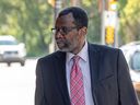 John Olubobokun walks into Saskatoon provincial court for the second day of his assault trial. He is charged with nine counts of assaulting former students by hitting them with a paddle as a form of discipline while he was the director of Christian Centre Academy, a private north-end Saskatoon Christian school, between 2003 and 2007.