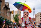 Politics tamfitronics Lauretta Peters hold an umbrella during pride parade in downtown Saskatoon, Sask., on Saturday, June 22, 2024.