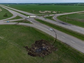 A scorched patch of ground where a bus carrying seniors ended up after colliding with a transport truck and burning is seen on the edge of the Trans-Canada Highway where it intersects with Hwy 5, west of Winnipeg near Carberry, Man., Friday, June 16, 2023.