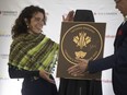Regina-born actress and 2022 Canada's Walk of Fame inductee Tatiana Maslany unveils a plaque during the Hometown Stars celebration at the Hotel Saskatchewan on Wednesday, June 26, 2024 in Regina.