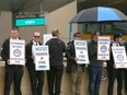 WestJet mechanics picket on the departures level at the Calgary International Airport in Calgary on Sunday, June 30, 2024.