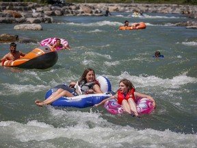 As large swaths of Western Canada bake under extreme heat, Calgary is reminding people trying to cool off to avoid using pink flamingo floaties and other rafts that puncture easily on its river. People raft in the Bow River trying to beat the heat in Calgary, Wednesday, June 30, 2021.