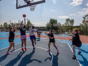 (From left) Meghan Morin, Sarah Wolfe, Anne Besong, Angel Celestino and Angelina Doyle play 3x3 basketball at the Pawatetan basketball courts in preparation for the YXE Urban Games 3x3 local tournament. Photo taken in Saskatoon, Sask. on Tuesday, August 13, 2024.