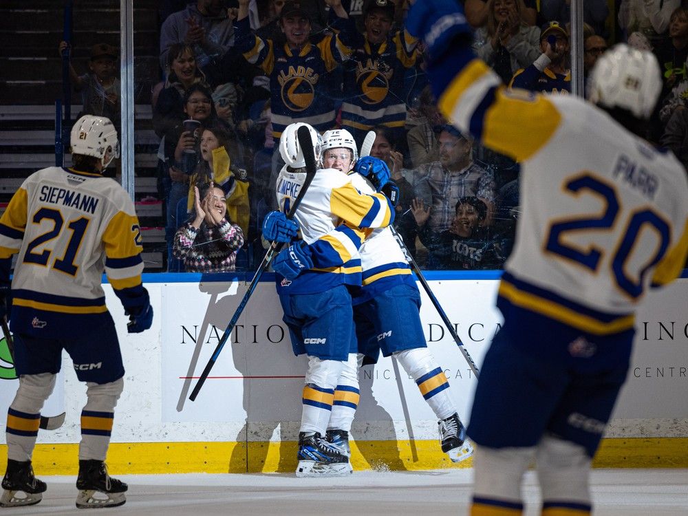 Saskatoon Blades Brayden Klimpke and William James celebrate a goal