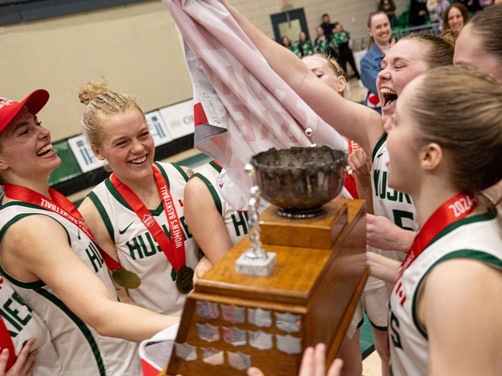 Saskatchewan Huskies celebrate their 10th Canada West women's basketball championship