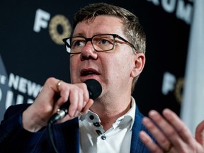 Scott Mo, Prime Minister in Saskatchewan, speaks during a media interview on the sidelines of the annual conference of Canada's strong and free network in Ottawa, on Friday, April 11, 2025.