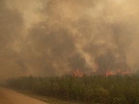 A wild fire blazes the hamlet of Weyakwin during the Ditch02 fire on Saturday, May 31, 2025 in Weyakwin. KAYLE NEIS / Regina Leader-Post