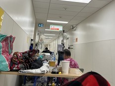 A view of a cramped hospital hallway.