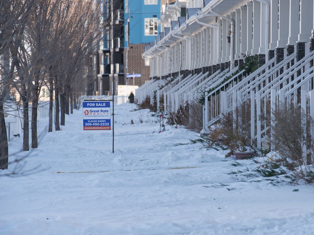 A for sale sign sits on the front yard of a home in the Harbour Landing neighbourhood in Regina, Saskatchewan on Nov. 13, 2020.