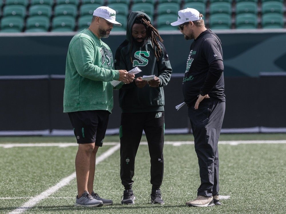 Saskatchewan Roughriders head coach Corey Mace speaks with his staff during practice at Mosaic Stadium on Wednesday, September 3, 2025 in Regina.