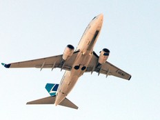 A WestJet plane flies above Calgary on Friday, Jan. 16, 2026.