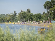 Beachgoers play in the sand and water at Katepwa Point Provincial Park on Tuesday, July 26, 2022.