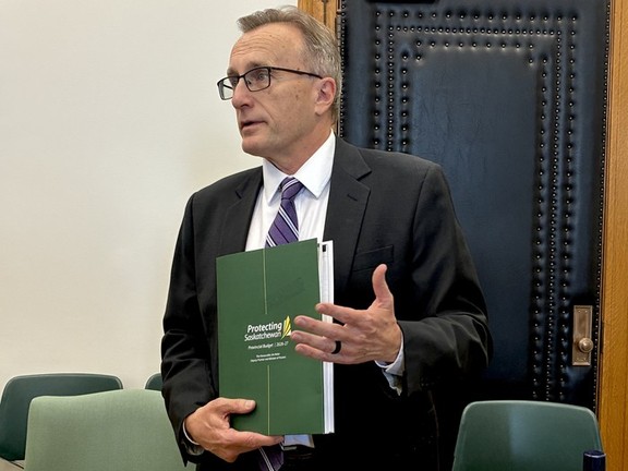 Finance Minister Jim Reiter holds the 2026-27 budget.