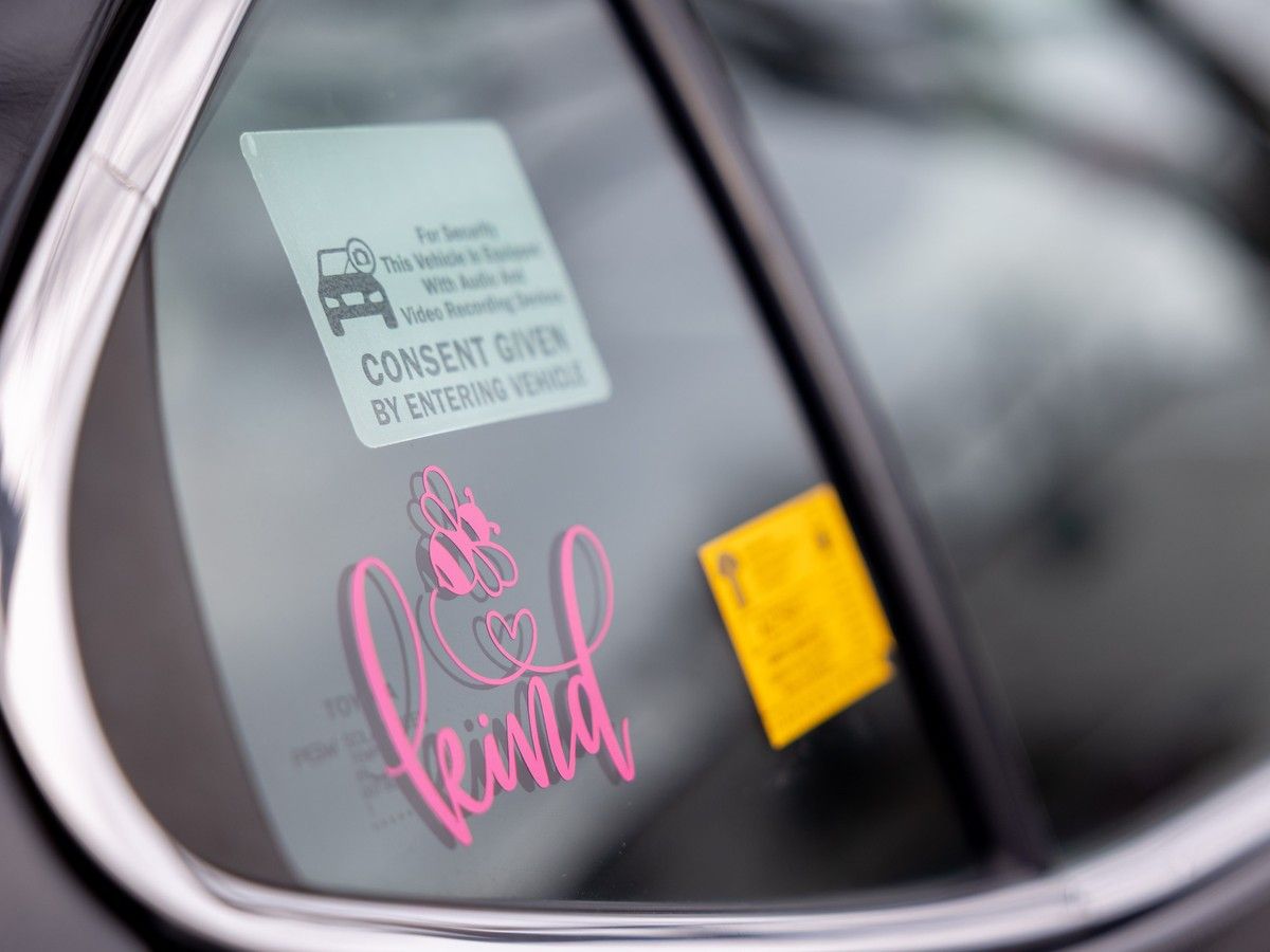  A sticker on Cheri Uthe’s car, which she drives for her rideshare app, Go Diva.