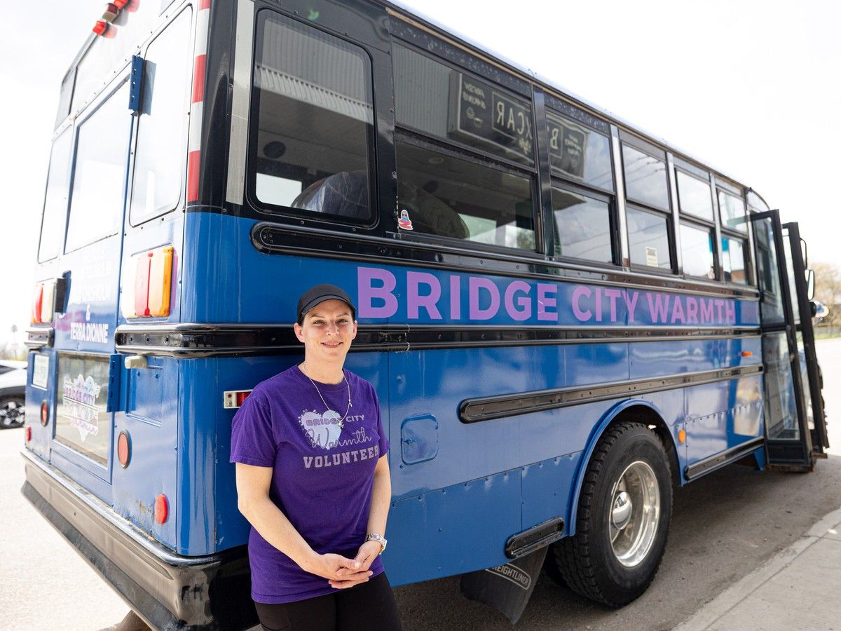 The blue bus — a new addition to Saskatoon — acts as transportation for volunteers who are handing out food and clothing to those in need.
