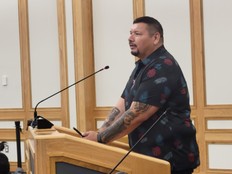 Chief Kelly Wolfe speaking at city hall.