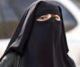 A woman wears a niqab as she walks Sept. 9, 2013 in Montreal.