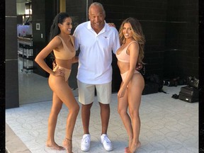 O.J. Simpson posed with model Laura Saucedo, right, in Vegas.