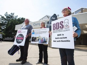 BDS protesters stand in front of Niagara Region Headquarters in St. Catharines on June 29, 2017. (POSTMEDIA NETWORK FILE PHOTO)