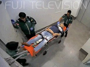 Kim Jong-nam lies dying on a stretcher at Kuala Lumpur Airport on Feb. 13.