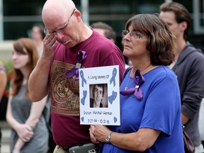 Don Harman and his wife Laura Marshall hold a photo of their son Graham Marshall-Harman who died of a fentanyl overdose in 2016.