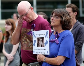 Don Harman and his wife Laura Marshall hold a photo of their son Graham Marshall-Harman who died of a fentanyl overdose in 2016.