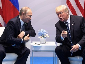 US President Donald Trump and Russia's President Vladimir Putin hold a meeting on the sidelines of the G20 Summit in Hamburg, Germany, on July 7, 2017. SAUL LOEB/AFP/Getty Images)