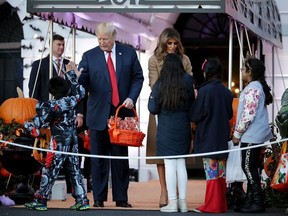 U.S. President Donald Trump (L) and first lady Melania Trump host Halloween at the White House on the South Lawn October 30, 2017 in Washington, DC.