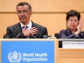 World Health Organization (WHO) Director General Ethiopia's Tedros Adhanom Ghebreyesus (L) reacts after his election in front of outgoing Director General China's Margaret Chan during the World Health Assembly (WHA) on May 23, 2017 in Geneva.