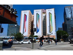 US-TECHNOLOGY-IPHONE-ADVERISEMENT

A skateboarder jumps the curb crossing a street in Los Angeles, California on october 13, 2017, where advertising for Apple's new iPhone X, due for release on November 3, covers the sides of three highrise buildings. / AFP PHOTO / FREDERIC J. BROWNFREDERIC J. BROWN/AFP/Getty Images
FREDERIC J. BROWN, AFP/Getty Images