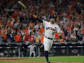 Houston Astros' Jose Altuve celebrates after hitting a home run during the fifth inning of Game 7 of baseball's American League Championship Series against the New York Yankees Saturday, Oct. 21, 2017, in Houston. (AP Photo/David J. Phillip)