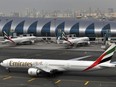In this Wednesday, March 22, 2017 file photo, an Emirates plane taxis to a gate at Dubai International Airport at Dubai International Airport in Dubai, United Arab Emirates. Long-haul carrier Emirates says it is starting new screening procedures for U.S.-bound passengers following it receiving "new security guidelines" from American authorities. (AP Photo/Adam Schreck, File)