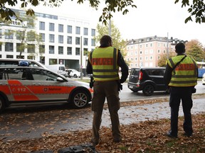 Police secure the area at Rosenheimer Platz square in Munich, Germany, Saturday, Oct. 21, 2017. Police say a man with a knife has lightly wounded several people in Munich. Officers are looking for the assailant. Munich police called on people in the Rosenheimer Platz square area, located close to the German city's downtown, to stay inside after the incident on Saturday morning. (Andreas Gebert/dpa via AP)