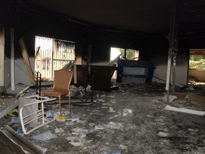 This Sept. 12, 2012 file photo shows glass, debris and overturned furniture are strewn inside a room in the gutted U.S. consulate in Benghazi, Libya, after an attack that killed four Americans, including Ambassador Chris Stevens.