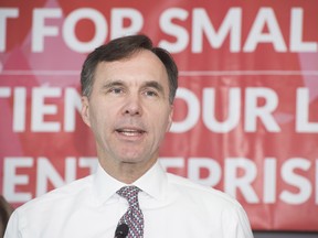 Minister of Finance Bill Morneau speaks to local business owners and media during a press conference at Station 33 Cafe & Yoga in Hampton, N.B., on Wednesday, Oct. 18, 2017. (Stephen MacGillivray/The Canadian Press)