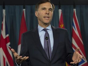 Minister of Finance Bill Morneau speaks with the media before question period on Parliament Hill, in Ottawa on Oct. 19, 2017.