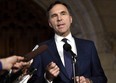 Minister of Finance Bill Morneau speaks to reporters in the Foyer of the House of Commons on Parliament Hill following Question Period, in Ottawa on Thursday, Oct. 26, 2017. THE CANADIAN PRESS/Justin Tang