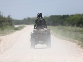 A U.S. Border Patrol agent patrols on an ATV near the U.S.-Mexico border in Mission, Texas. (John Moore/Getty Images)