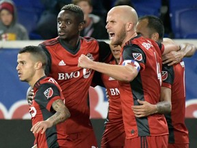 Michael Bradley celebrates a goal by Victor Vazquez during the first half of an MLS Eastern Conference semifinal soccer match against the New York Red Bulls on Oct. 30, 2017. (AP)