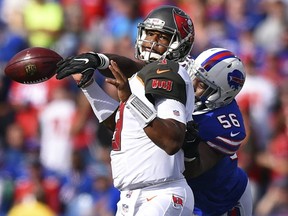 Buffalo Bills' Ryan Davis (56) strips the ball from Tampa Bay Buccaneers quarterback Jameis Winston (3) during the first half of an NFL football game Sunday, Oct. 22, 2017, in Orchard Park, N.Y. The Bills recovered the ball. (AP Photo/Rich Barnes)